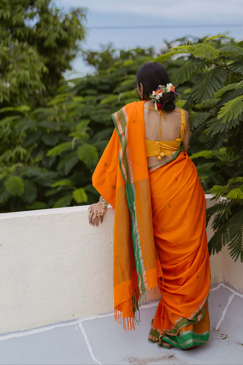 Women wearingHandwoven cotton Jamdani saree in orange and green, soft and lightweight