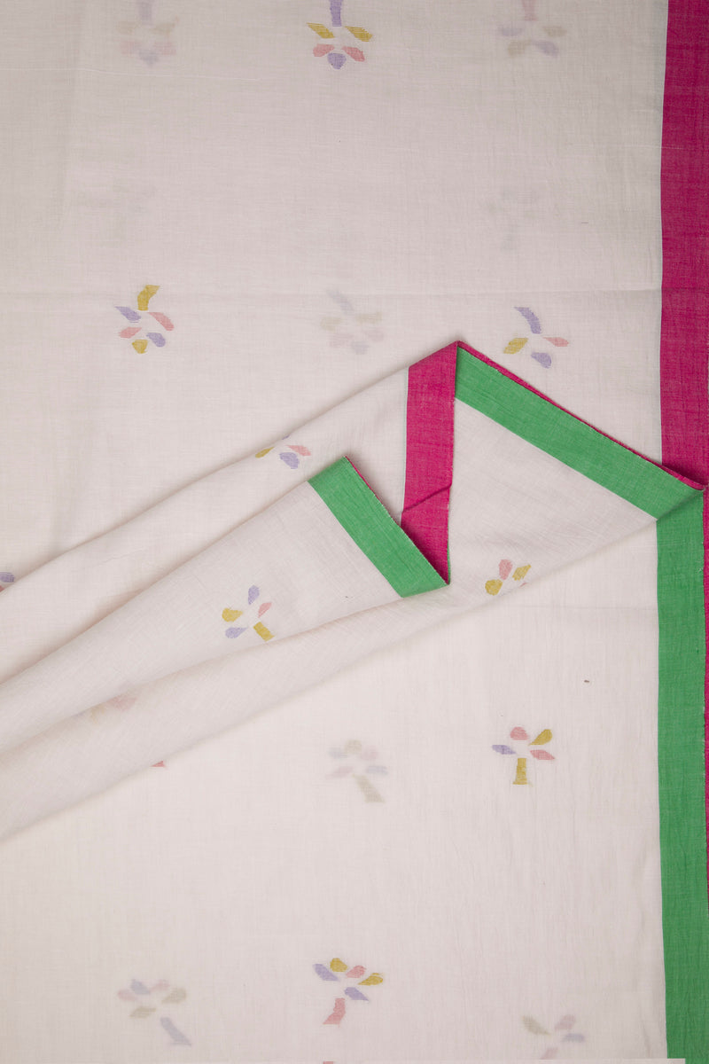 Close-up of fabric with colorful floral jamdani motifs  and green and pink borders.