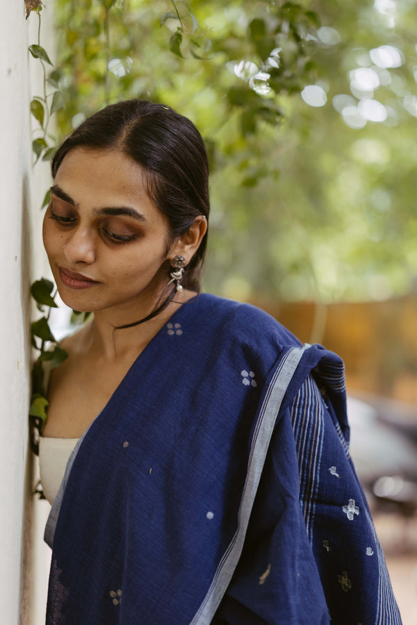 Close up pic of jamdani motifs on an indigo saree 