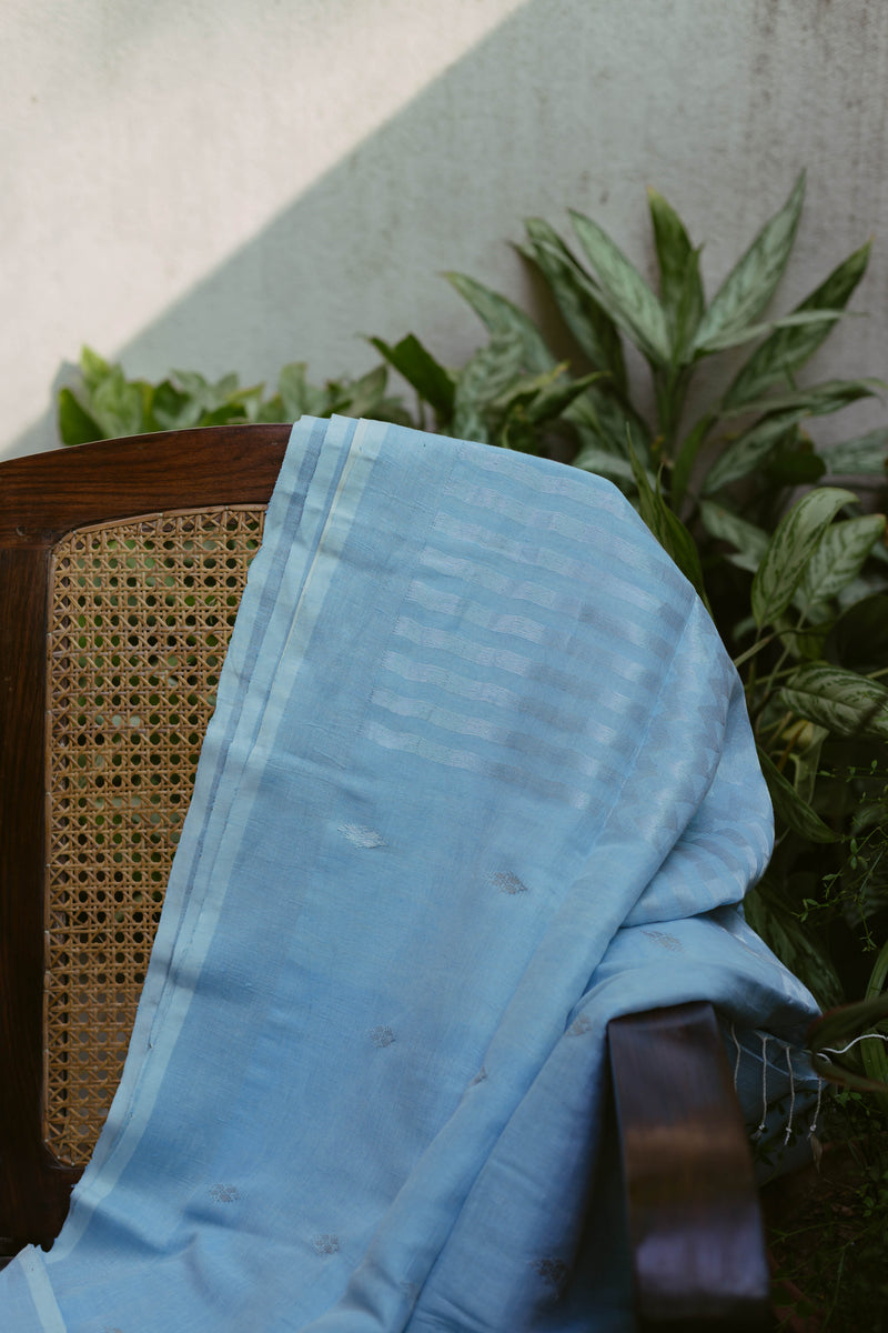 Handwoven baby blue linen saree with subtle silver Jamdani weave