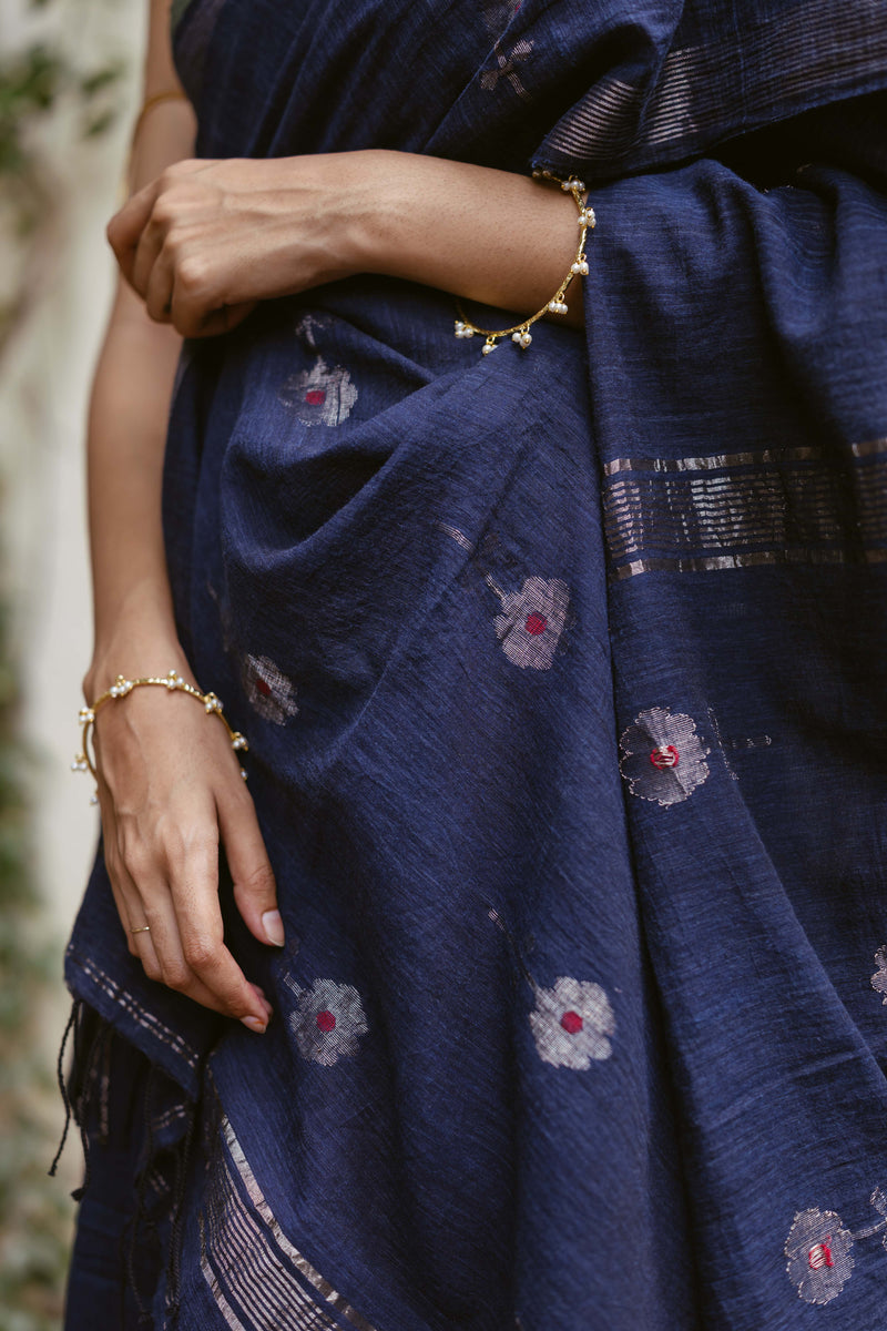 Closeup of jamdani motifs in silver zari 