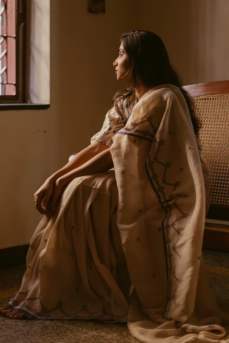 Lightweight Beige & Indigo Linen Jamdani Saree styled with grace.