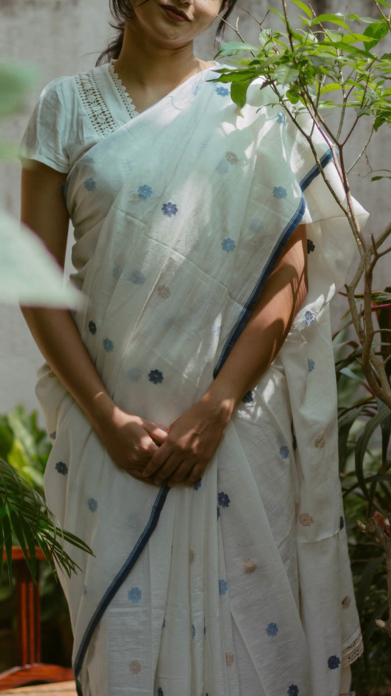Elegant White & Indigo Jamdani Saree styled with delicate details