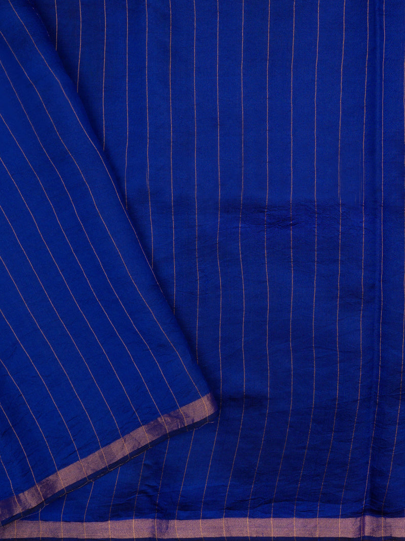 Elegant royal indigo jamdani silk saree with antique zari border and authentic weaving.