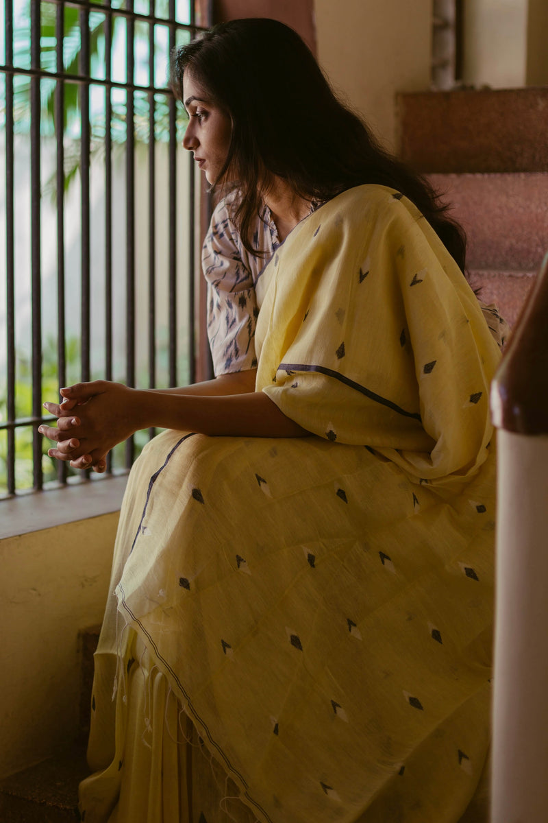 Handwoven Lemon Yellow Jamdani Saree with black edging and woven motifs