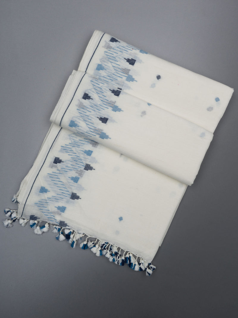 Close-up of Jamdani weave texture on white cotton saree with indigo accents and fine threadwork by varsaaedit