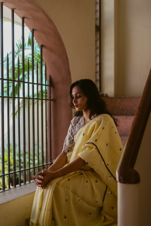 Lemon Yellow Handloom Linen Jamdani Saree with contrast border draped gracefully