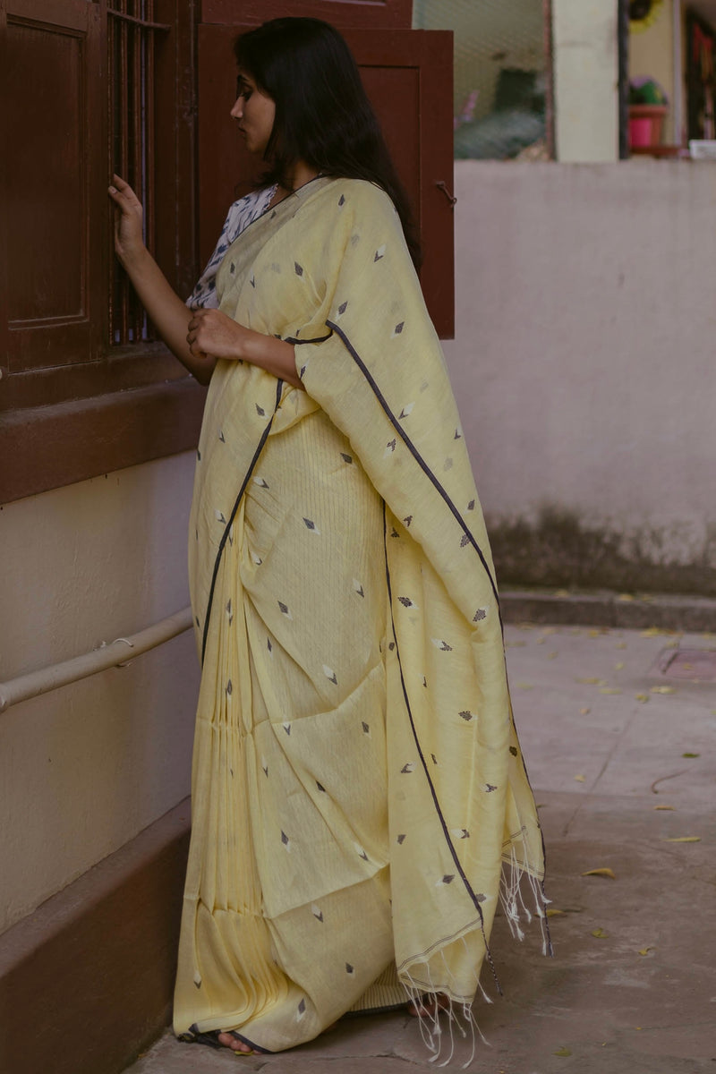 Soft Linen Lemon Yellow Saree with Jamdani weave details and delicate drape