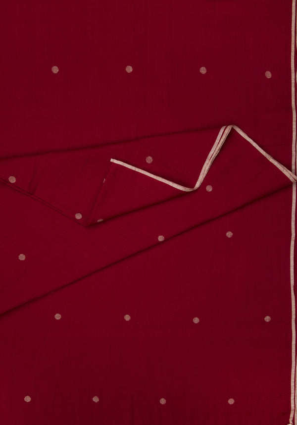 Red fabric with white polka dots  jamdani and creme selvedge 