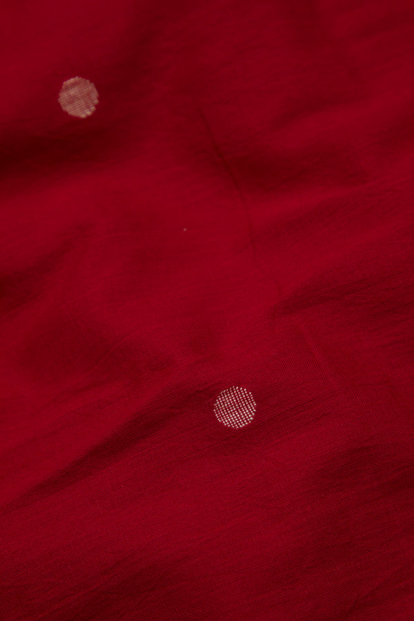 Close-up of a red fabric with jamdani motifs 