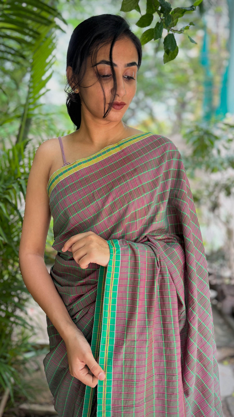Soft cotton saree with neon green stripes and traditional hand-tied tassels