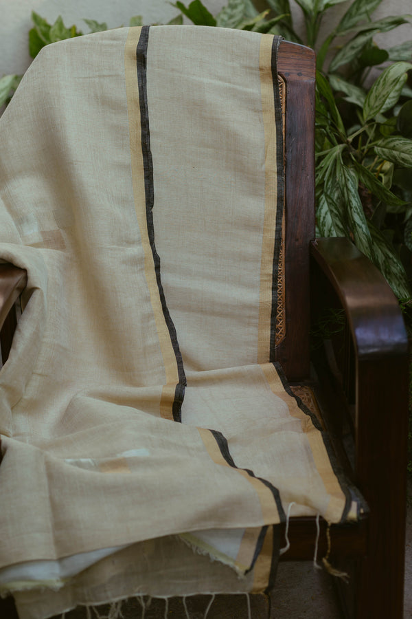 Traditional Ivory & Gold Pure Linen Saree handwoven by artisans, blending minimalism with heritage weaving.