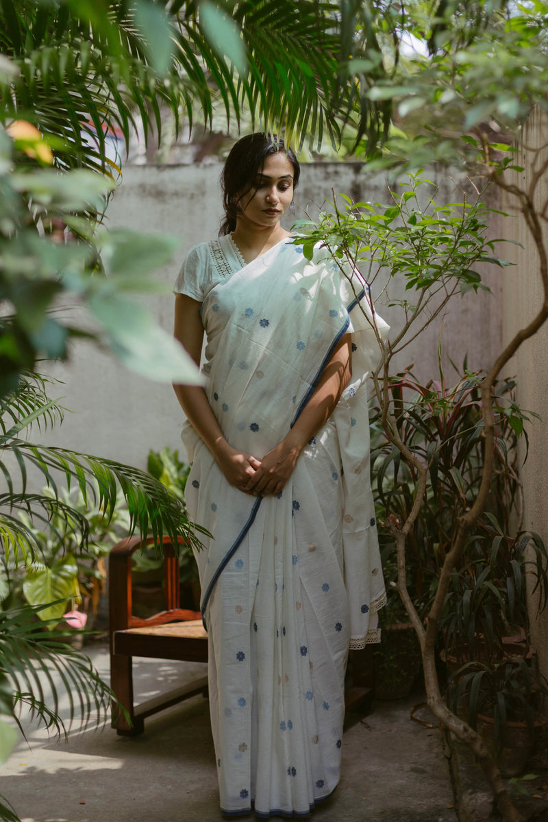Close-up of Indigo floral motifs on White Bengal Jamdani Saree