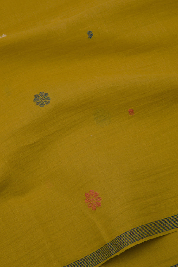 yellow handwoven Jamdani fabric with floral motifs and striped selvedge, artisan cotton from India.