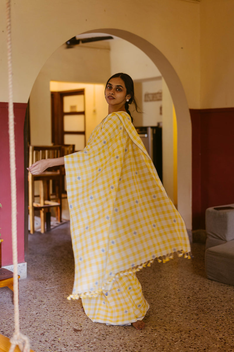 model in a yellow jamdani cotton saree celebrating diwali