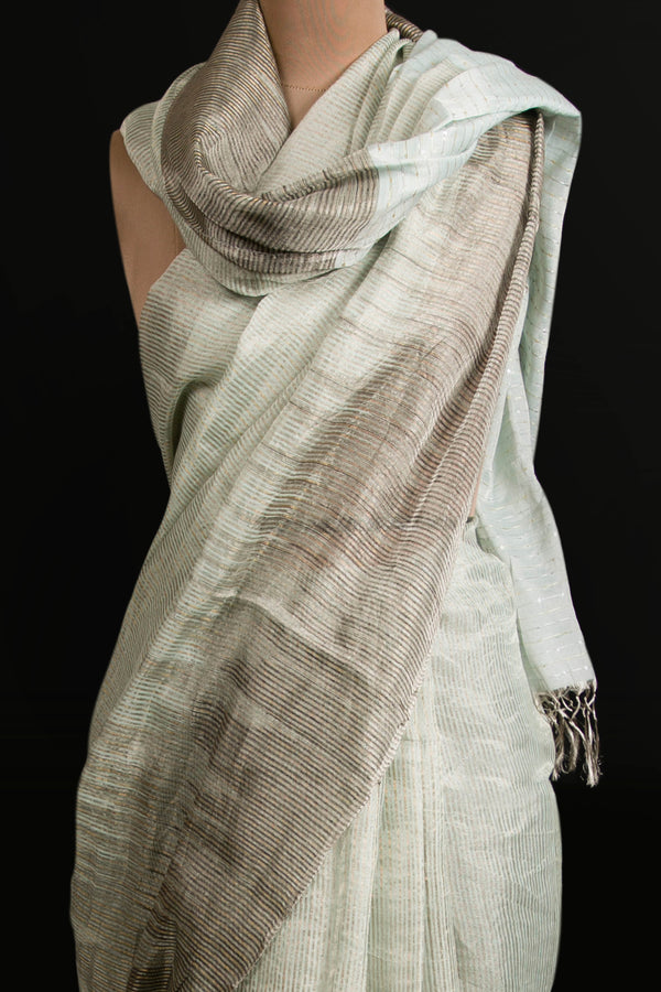 Elegant handwoven blue linen tissue saree with silver border for festive wear
