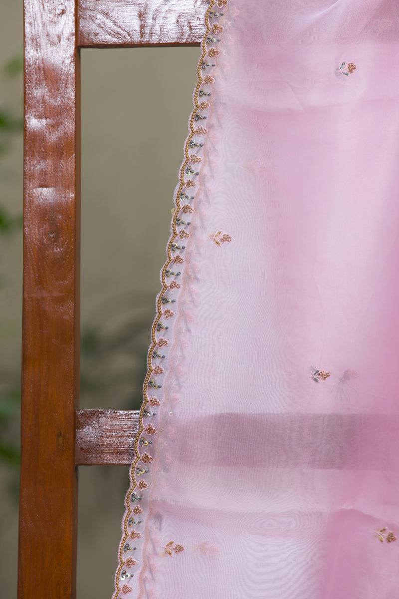 Close-up of embroidered flowers on Fairyland organza silk saree in light pink