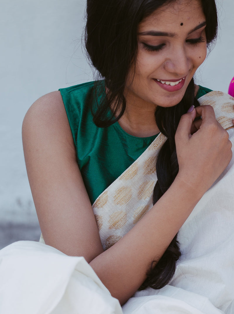 Designer Chanderi silk saree with golden motifs and green blouse