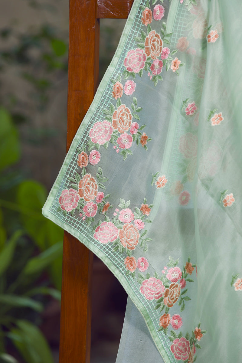 Floral Embroidered Green Silk Organza Saree with Intricate Detailing – A detailed view of the embroidered floral border on a soft green silk organza saree.