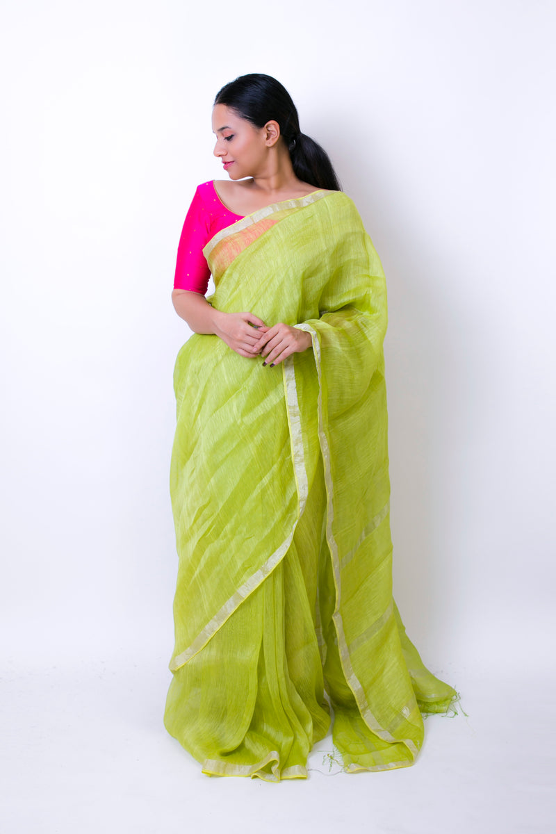 Beautiful handwoven linen silk saree in green with shiny silver border