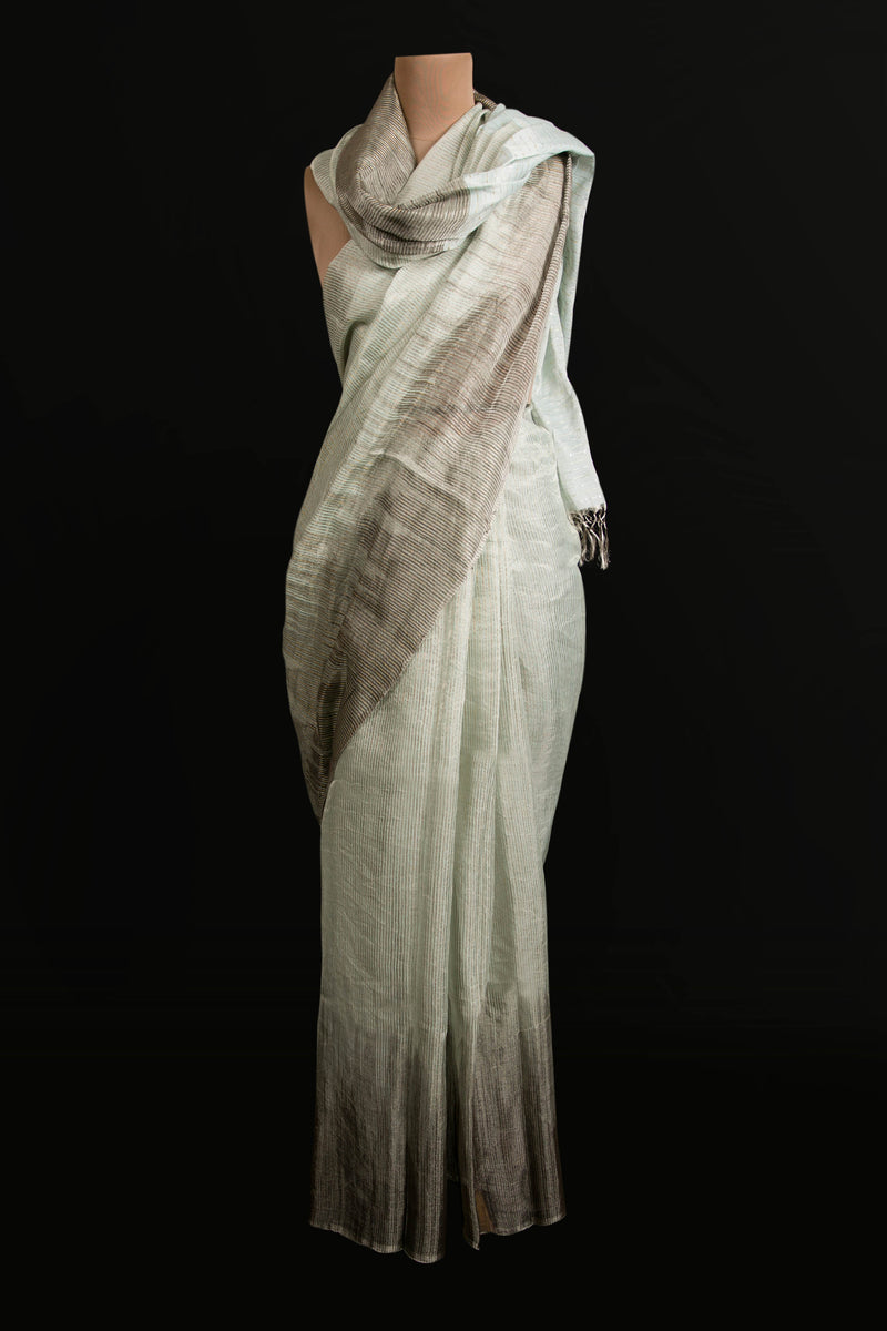 Lightweight linen tissue saree in pastel blue with handwoven texture