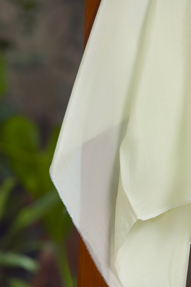 Contemporary pastel Jamdani organza saree with woven geometric motifs
