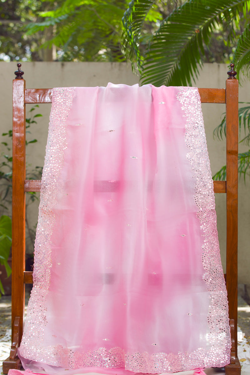 Pastel pink sheer organza sari featuring sparkling mirror butis and lace border