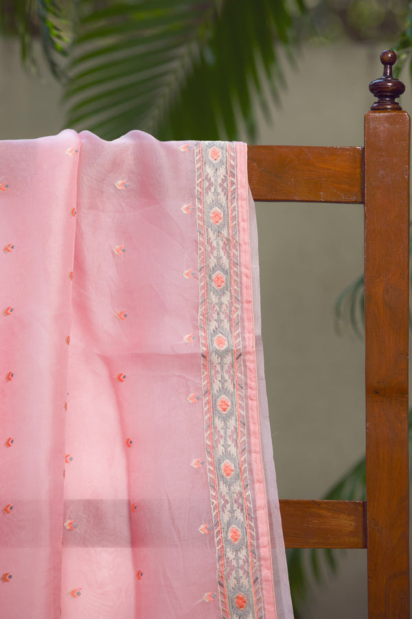 Pink Poise Silk Organza Saree with Embroidery Detail – A close-up shot showcasing intricate embroidery on a soft pink silk organza saree.