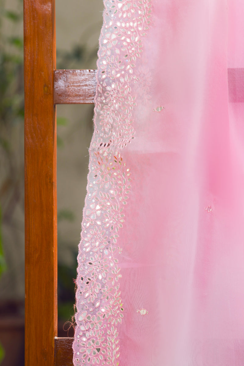 Rose pink organza saree for weddings with mirror work and delicate scalloped edge