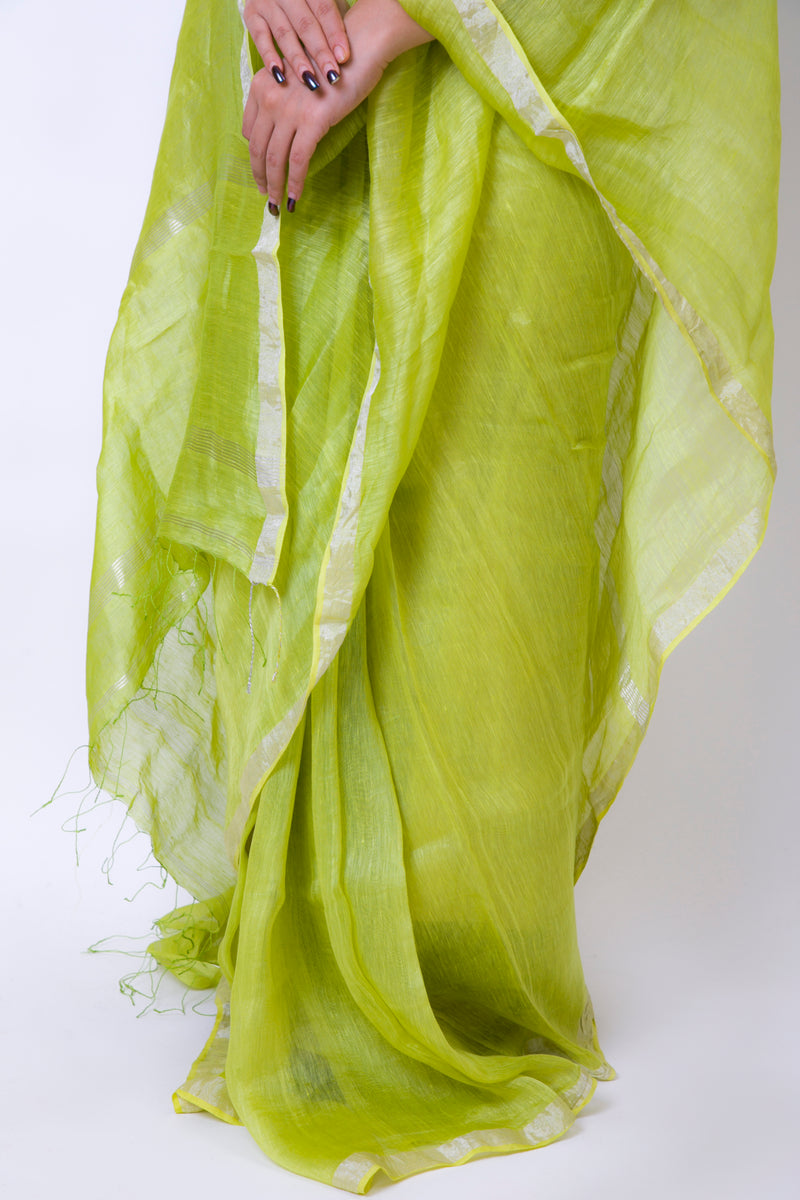 Side view of handwoven linen silk saree in Gorgeous Green with fine silver detailing