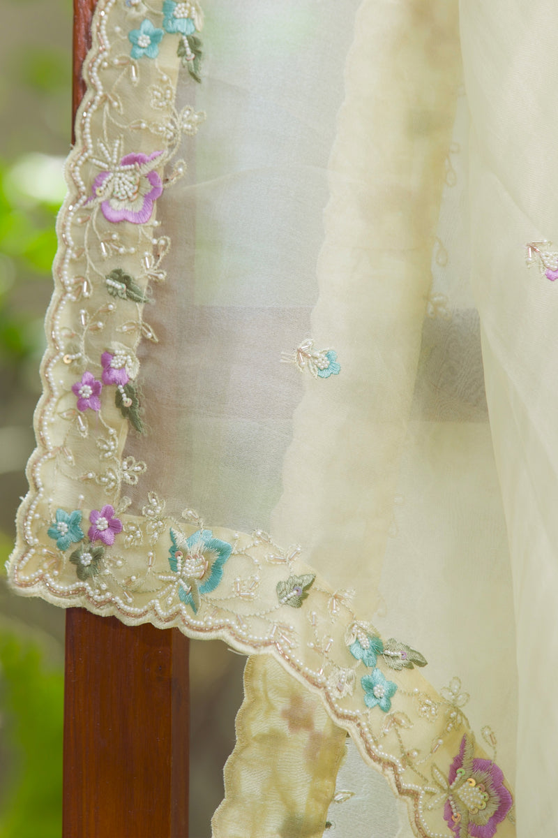 Sheer silk organza sari featuring multicolor floral border and delicate beadwork