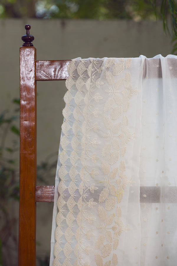 Snow Garden Silk Organza Saree with Beige Embroidery – A close-up shot showcasing intricate beige floral embroidery on a delicate white silk organza saree