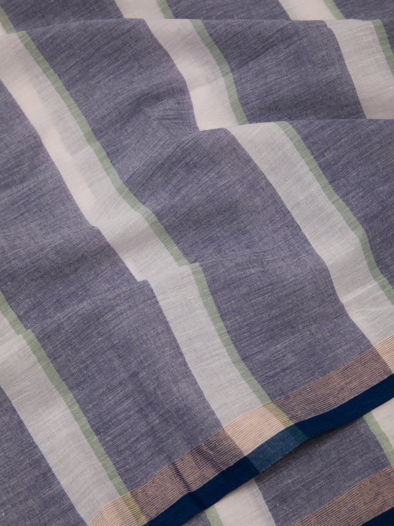 Striped cotton saree with handwoven texture and tassel accents