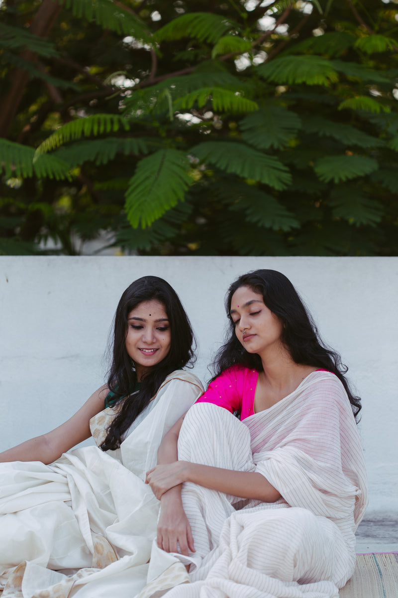 Stunning golden striped handwoven muslin saree with traditional Indian blouse and accessories