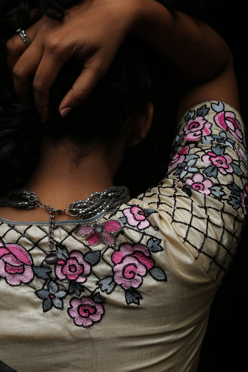 varsaaedit Secret Garden blouse shoulder and sleeve detail with beaded lattice on champagne-gold fabric and pink floral embroidery