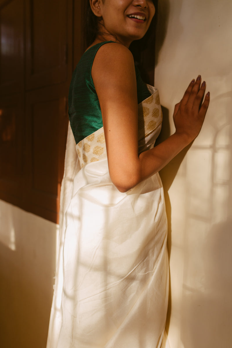 Premium white Chanderi silk saree with golden border